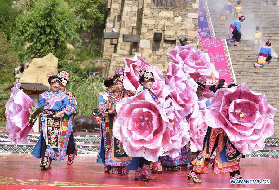 Women of Qiang ethnic group dance at folk Waerezu Festival