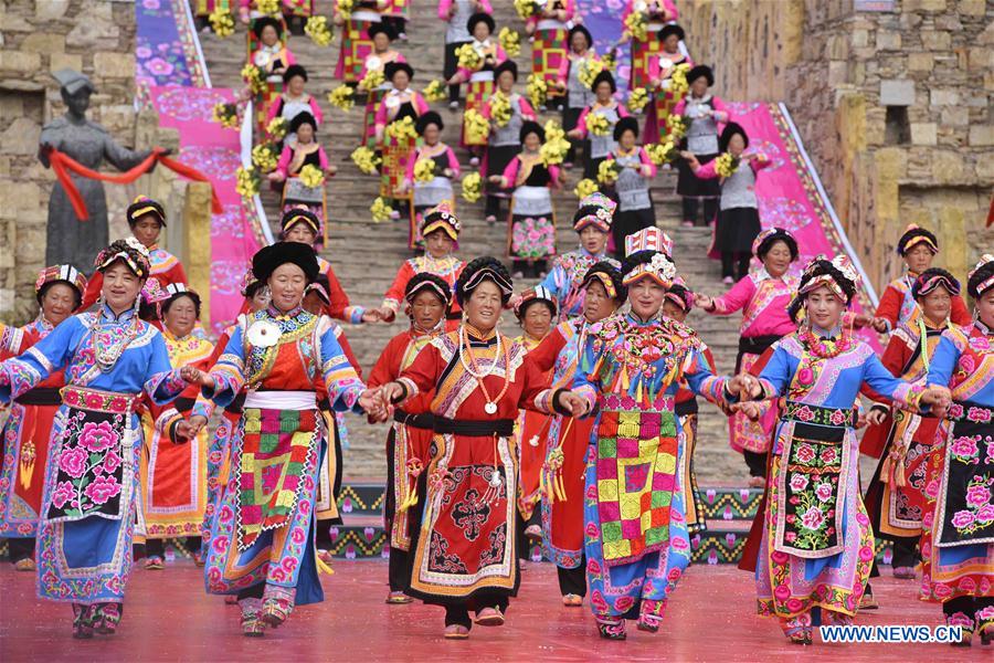 Women of Qiang ethnic group dance at folk Waerezu Festival