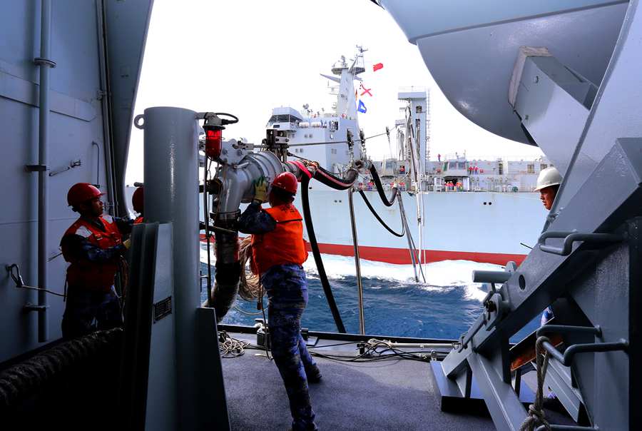 Landing ship executes replenishment-at-sea with new comprehensive supply ship
