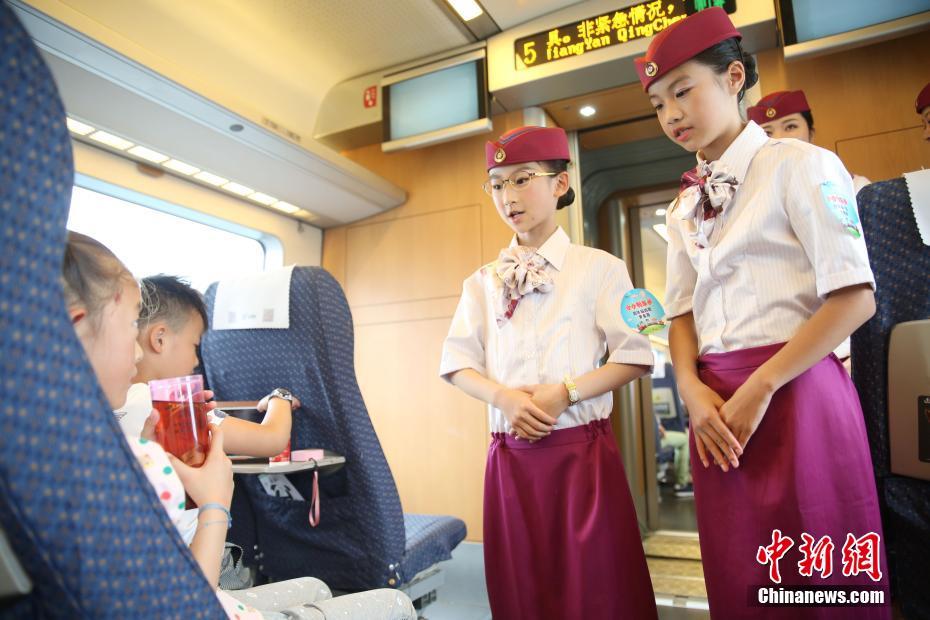 Little 'attendants' celebrate Children's Day on board bullet train