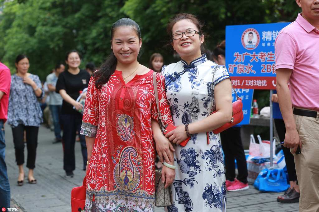 Anxious parents don lucky red clothing outside college entrance exam sites