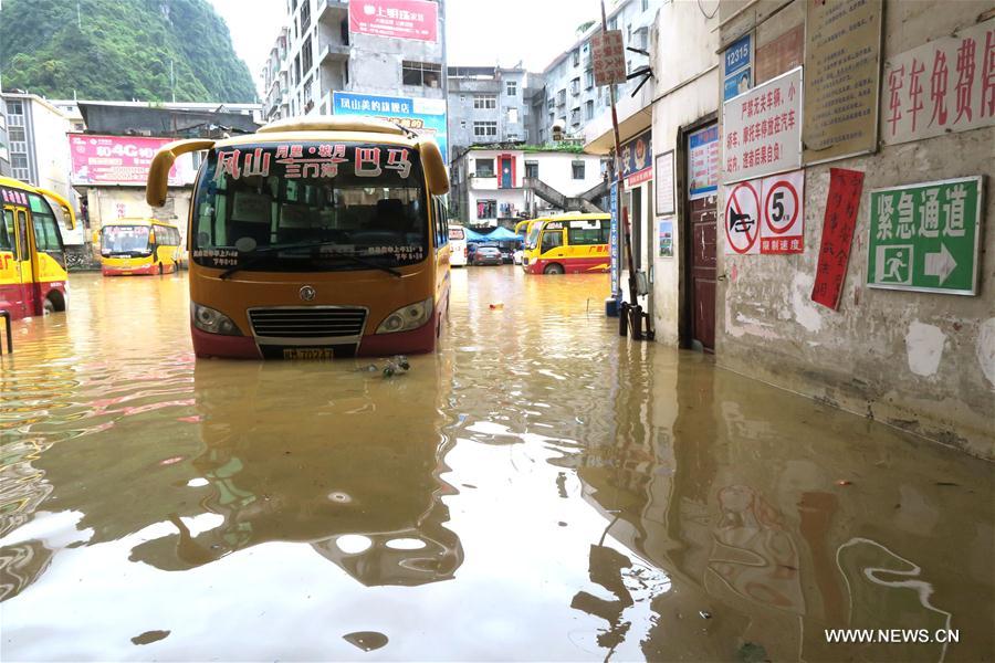 Torrential rain hits south China's county, causing flood