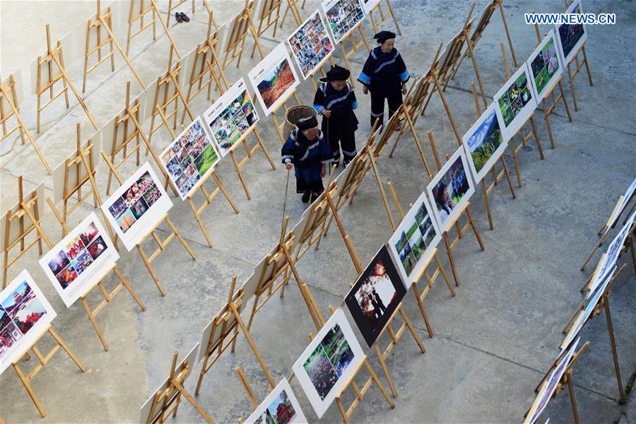 Photo exhibition on customs, life of villagers held in SW China