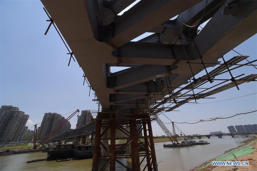 Pedestrian bridge across Liuyang River under construction in C China
