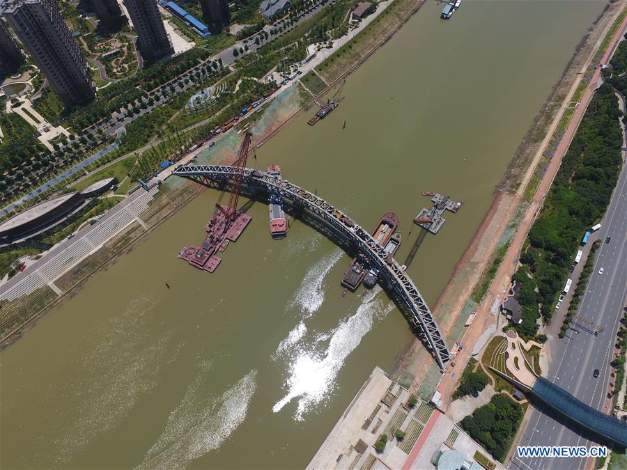 Pedestrian bridge across Liuyang River under construction in C China
