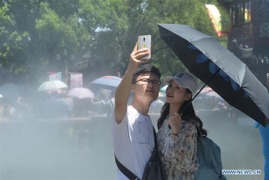 Mist cooling systems bring coolness to visitors in China's Shanghai