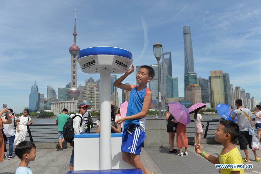 Mist cooling systems bring coolness to visitors in China's Shanghai