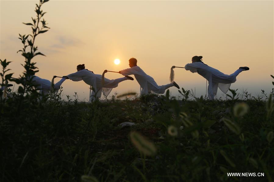 People enjoy outdoor exercises in summer day in China