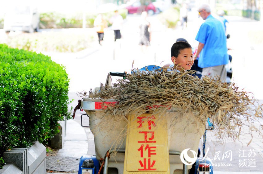 Boy spends special summer holiday with his grandpa, a sanitation worker