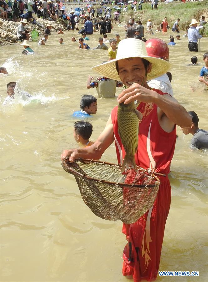 Fish-catching activity held in SW China's Guizhou