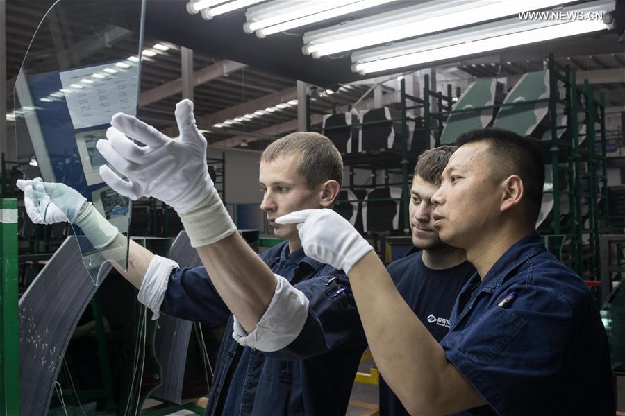 Workers busy at Russian factory of China's Fuyao Glass in Kaluga