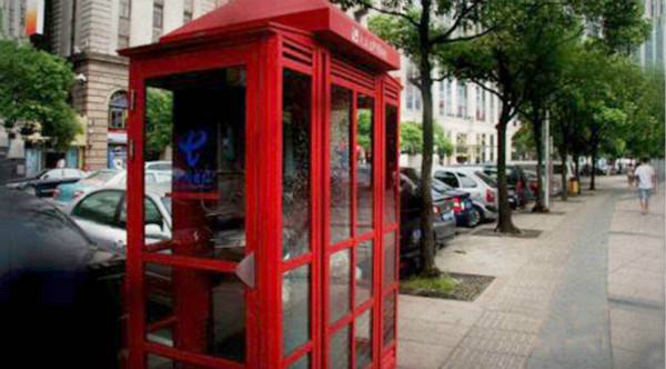Shanghai's red telephone boxes get new life as mini-libraries