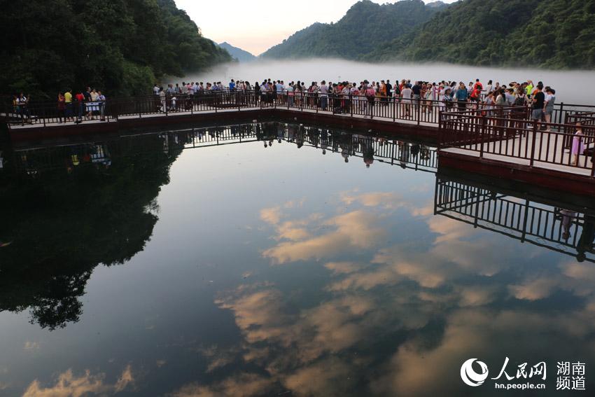 Dongjiang Lake cloaked by mist in Hunan
