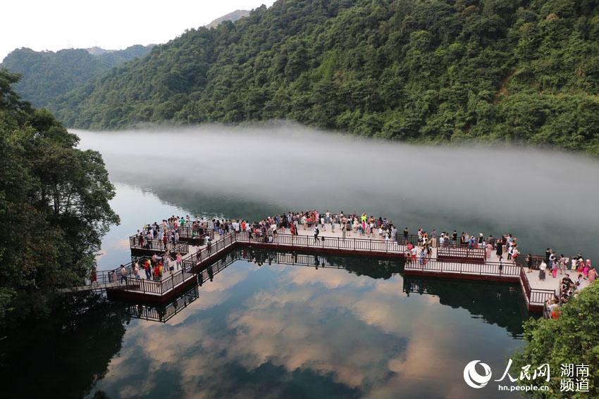 Dongjiang Lake cloaked by mist in Hunan