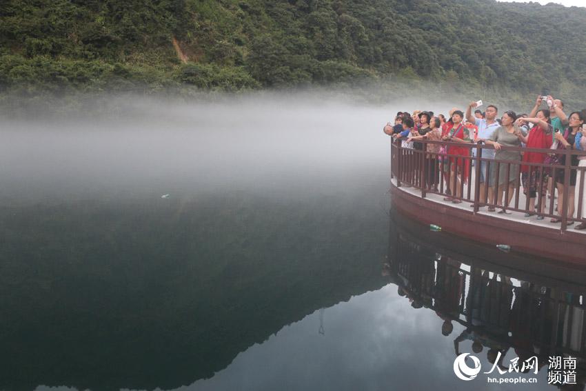 Dongjiang Lake cloaked by mist in Hunan