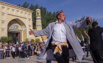 People dance to observe Eid al Adha in Xinjiang