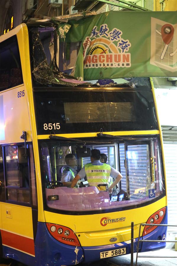 Three killed, 27 injured as bus mounts pavement in Hong Kong