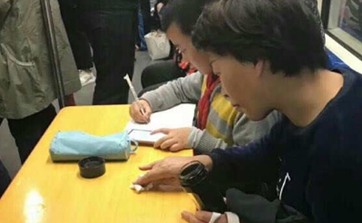 Shanghai elementary student who does homework on subway triggers debate