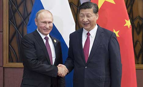 Xi, Putin pledge to enhance regional, int'l cooperation