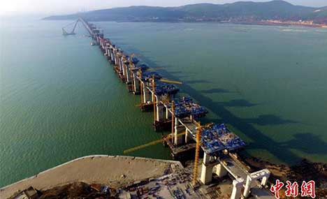 China's first cross-sea rail-road bridge takes shape