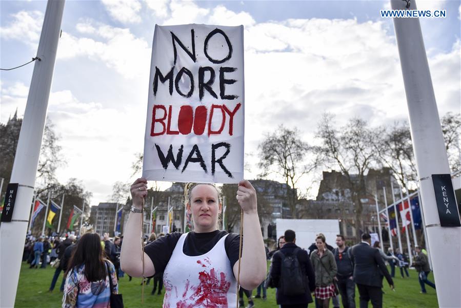 Demonstrators take part in protest organized by Stop the War Coalition in London, Britain