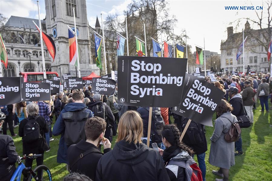 Demonstrators take part in protest organized by Stop the War Coalition in London, Britain