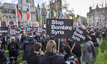 Demonstrators take part in protest organized by Stop the War Coalition in London, Britain