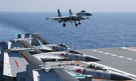 Aircraft carrier formation conducts exercises