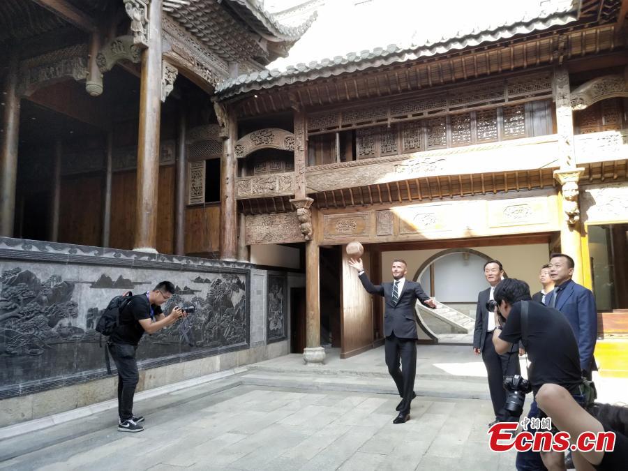 Beckham tries ancient football in China