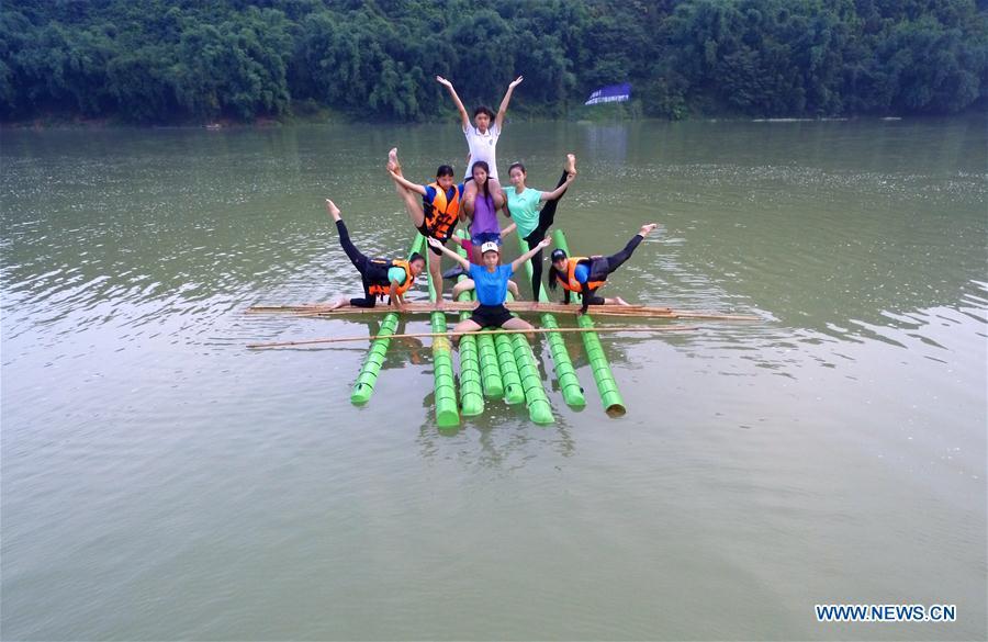 Students practice single bamboo drifting in Guizhou