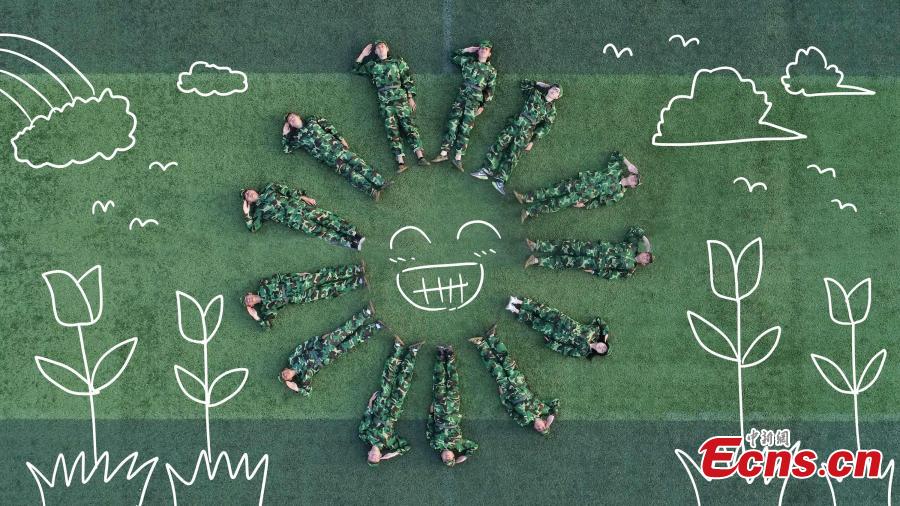 128 students mark military training with creative postures