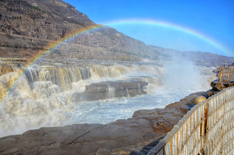 Rainbow and icicles appear at Hukou Waterfall