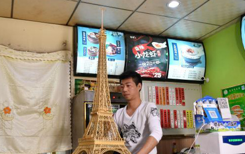 Chinese wonton restaurant owner creates model of Eiffel Tower with bamboo sticks
