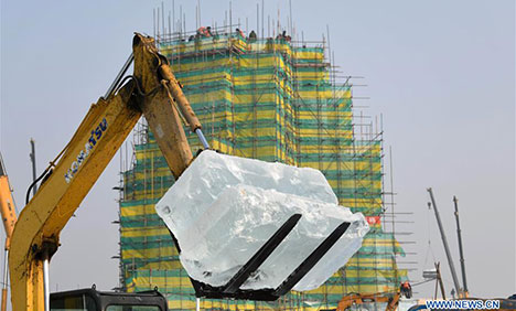 People work at Ice and Snow World theme park in Harbin