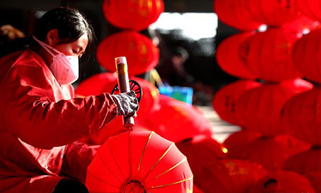 Craftsmen busy making red lanterns as New Year approaches