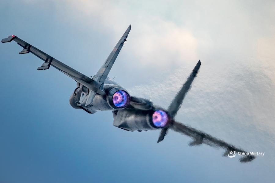 J-11B fighter jet flies past the sun