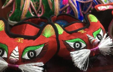 23-year-old man makes lucky tiger-head shoes