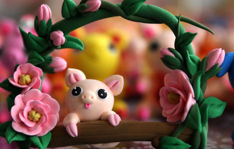 Clay piggy figurines welcome Year of the Pig