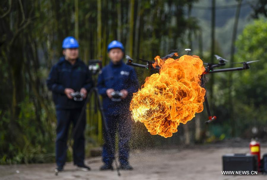 Fire-spewing drone cleans garbage on power lines in Chongqing