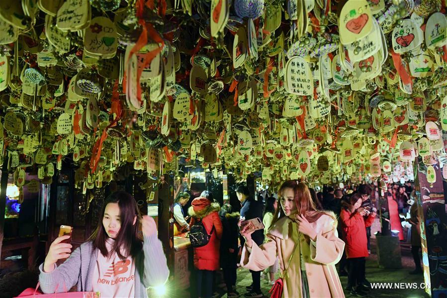 Tourists visit Lijiang ancient town in southwest China's Yunnan