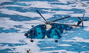 Air force personnel simulate rescue and recovery operations