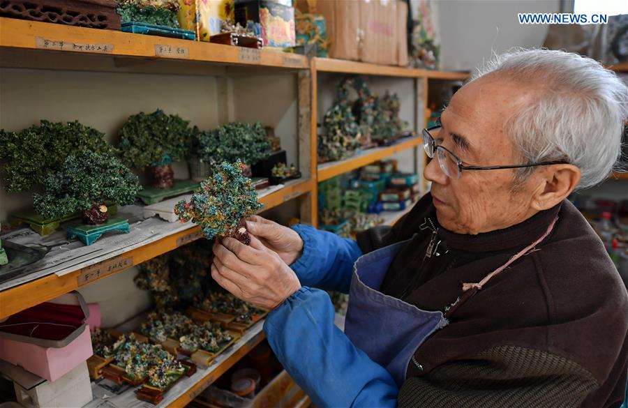 Inheritor of coloured glaze firing skill transforms waste into artwork in China's Shanxi