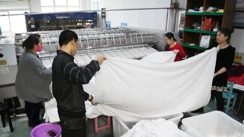 Charitable laundry in Changchun gives hope to people with autism