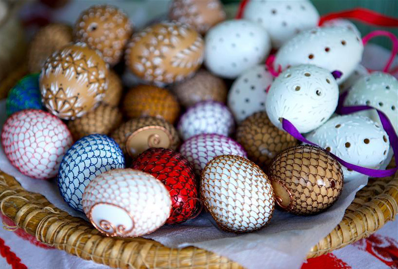 People paint eggs to celebrate Easter in Prague