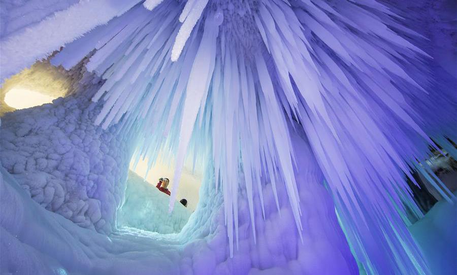 Tourists visit ice cave in Luyashan scenic area, north China's Shanxi