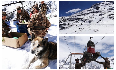 Soldiers transport goods in Tibet's snow-capped mountainous area