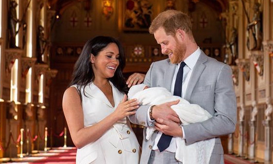 Prince Harry, Meghan Markle pose for photos with their son