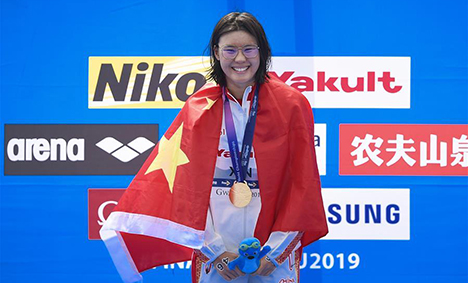 Xin wins 1st gold for China in open water swimming at FINA worlds
