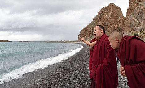 11th Panchen Lama worships on bank of Nam Co Lake in Tibet