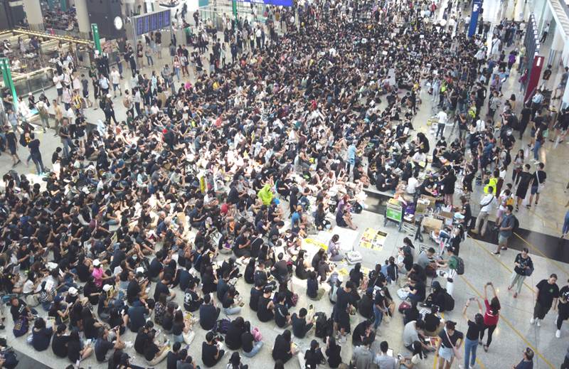 Protesters hold unauthorized rally in Hong Kong airport, upset passengers